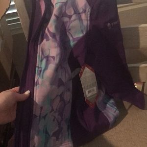 Girls jacket new with tags size 7-8 soft in the inside cute colors